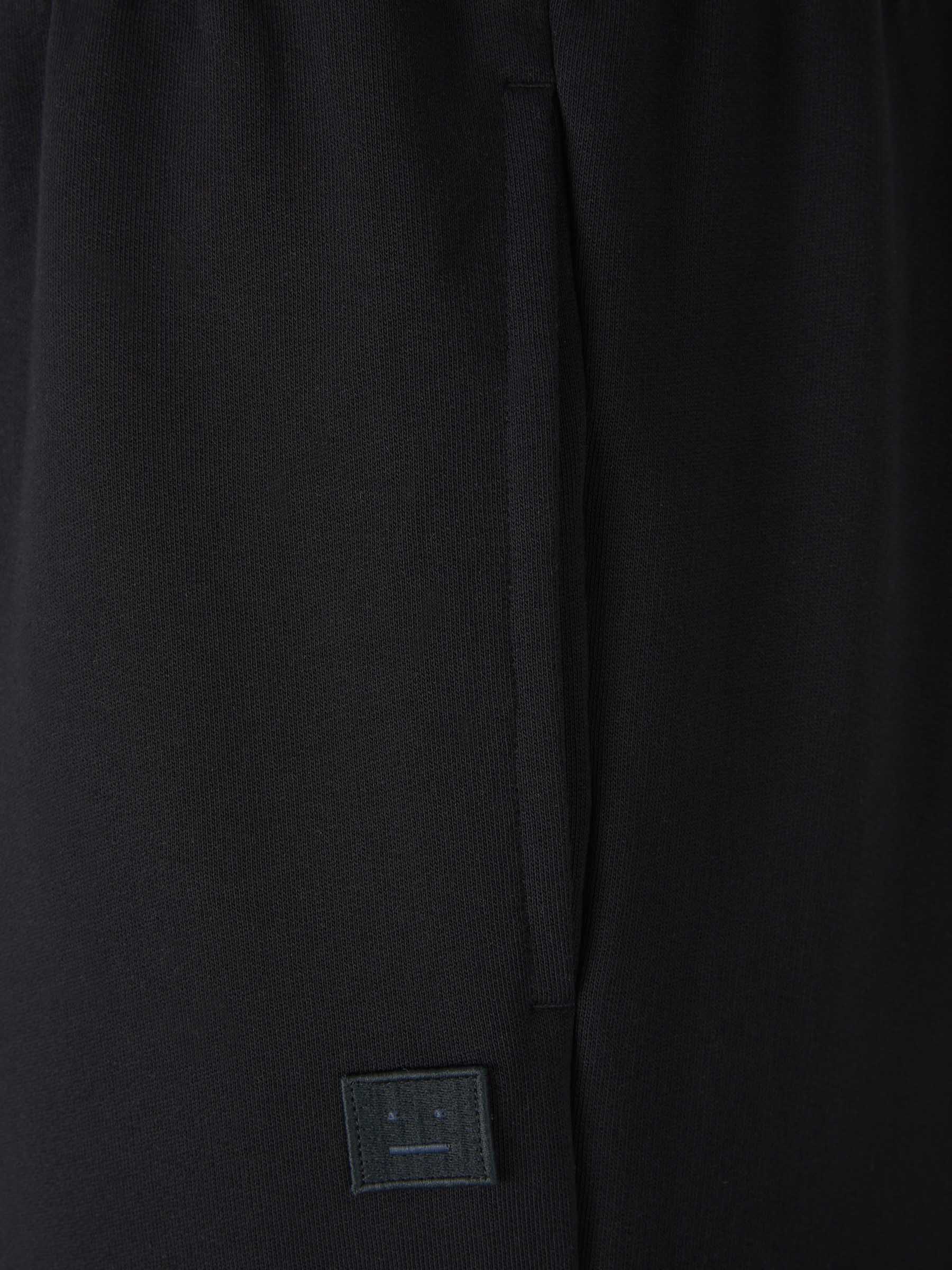 Outlet online Acne Studios Face Hombre Joggers Parche Cara color Negro sku 521-002710 01 - Foto 3